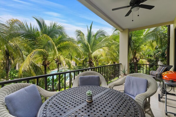 L309 has a beautiful terrace that overlooks the pool but has swaying palms in front to create privacy.