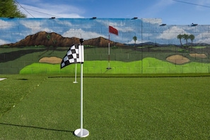 Sharpen up your short game before going out to one of the top golf courses nearby.
