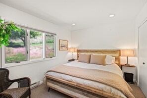 Primary bedroom with plush king-sized bed.