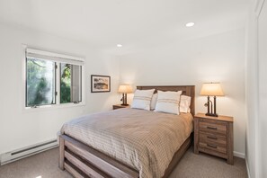Guest bedroom with queen-sized bed.