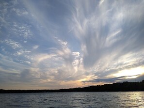 Sunsets over the lake are more spectacular when clouds paint the sky