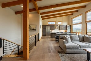 Open concept kitchen, dining and living areas