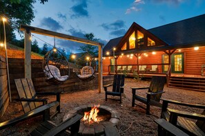 Relax and create lasting memories and family around the custom-built firepit!