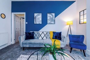 The spacious living space benefits from 2 sofa beds, a 40-inch smart TV and plenty of space to sit down and relax.