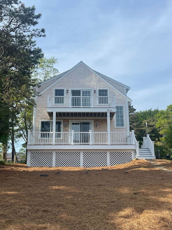 Beautiful newly built home with two front decks viewing Wellfleet Bay, a large family room and an outdoor shower