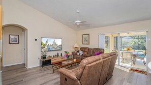 Cozy living room with comfortable seating and a large TV for entertainment.