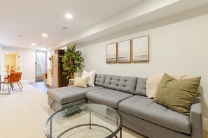 Oversized couch with chaise lounge converts into queen size tempur pedic bed