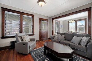 Cozy living room opens into dining room.