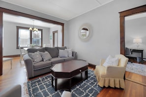 View into dining room and den/home office.