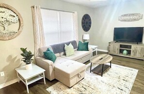 Comfy LR has a pullout sofa that sleeps 2, and a chaise lounge. 50" Amazon Fire Smart TV loaded with all the top streaming apps.