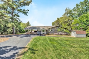 Inviting front lawn with panoramic lake views.