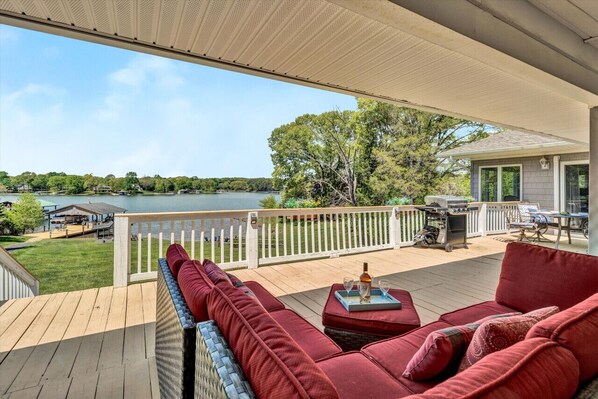 Relax in comfort with stunning lake views from your outdoor seating area.