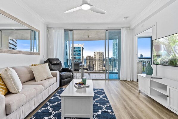 Luxurious living room overlooking the river and the city