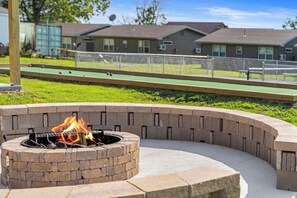 A brand new fire pit with a surrounding bench is available for your use.