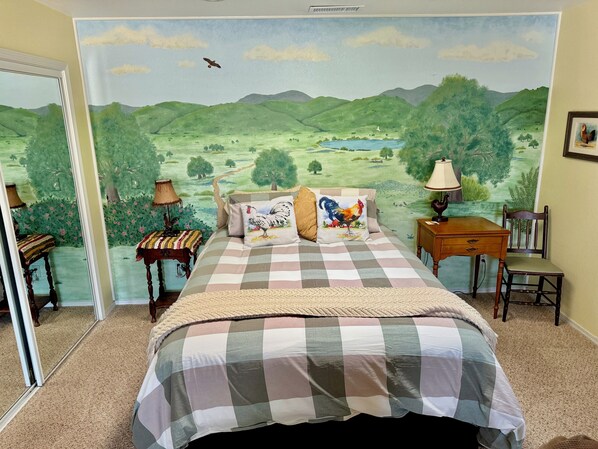 Queen bed and beautiful landscape mural