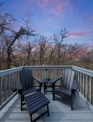 Our deck that overlooks a wooded backyard.