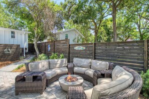 Large sofa and a firepit, perfect for entertaining.