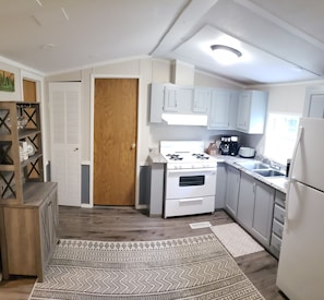 Fully loaded kitchen for cooking, grilling, and serving your group.