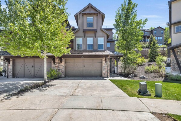 Exterior: View of the front of the home, driveway w/parking space for 2 cars and 1 car in the garage