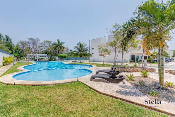 Enjoy a refreshing dip in the communal pool