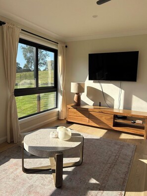The Fig: Sunsoaked lounge room with views out across the paddocks