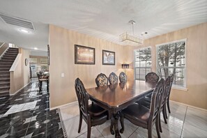 Main spacious dining table that sits 6 with full tableware and silverware included.