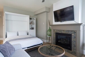 Murphy bed located in the living area. Pull down and sleep on the queen size bed.