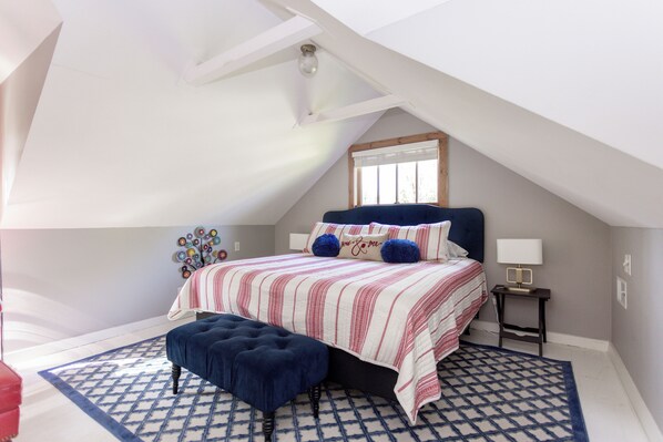 King bed in the upstairs sleeping loft
