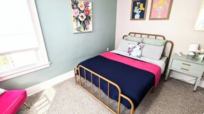 Primary Bedroom with Queen Bed, Sitting Chair, Nightstand, Closet and Mirror