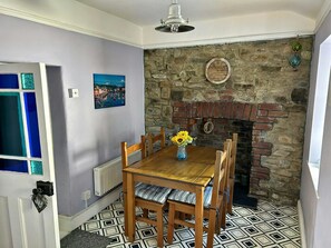 Dining room with table and chairs and fireplace