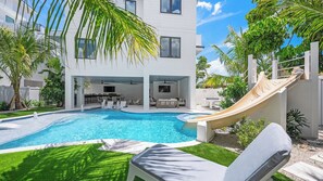 Resort Style Pool w/ Water Slide, Heated Spa, and Sun Shelf