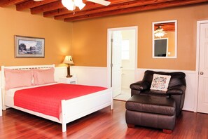 Main Cabin - Bedroom 1 with woods and lake view, elec fireplace, full bathroom