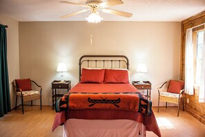 Small Cabin - Full sized bed with sliding glass doors out to the expansive porch