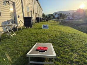 Backyard fun starts with a game of cornhole!