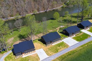 Bird’s eye view of Still Water Flats: four 2-bedroom chalets and one 4-bedroom river house, all just steps from the water.