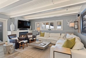 Cozy living area with fireplace and Big Screen TV