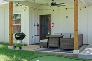 Weber Charcoal Grill & Comfy Lounge Area on the back covered patio - you'll enjoy your evenings back here!