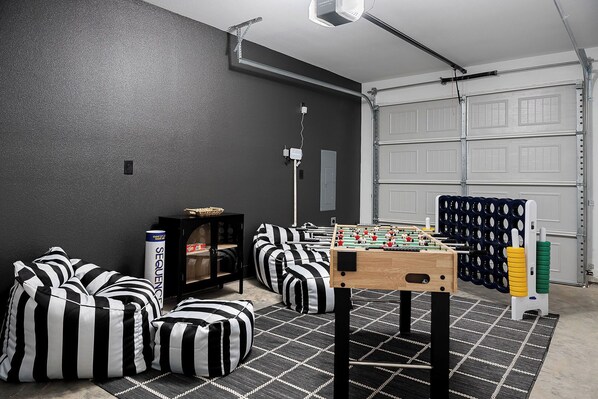 Game Room in the outside Garage - Foosball, Giant Connect4, Jumbo Sequence, Giant Uno with comfy bean bag chairs.