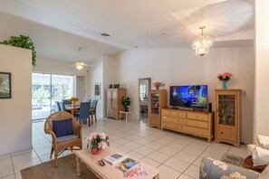 Open living room and dining area. Large Roku TV for streaming. No cable.
