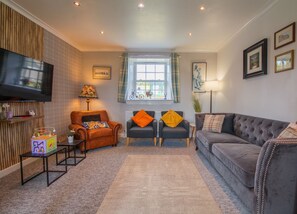 Living room - another wider view of the living room and the comfortable armchairs