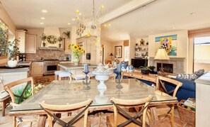 Beautiful natural light highlights the vaulted ceiling of the spacious living area.