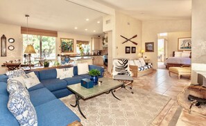 Second floor open living area. French doors lead to the primary suite and balcony.