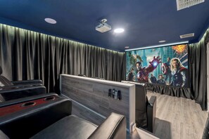Private theater with stadium risers and 6 recliners.