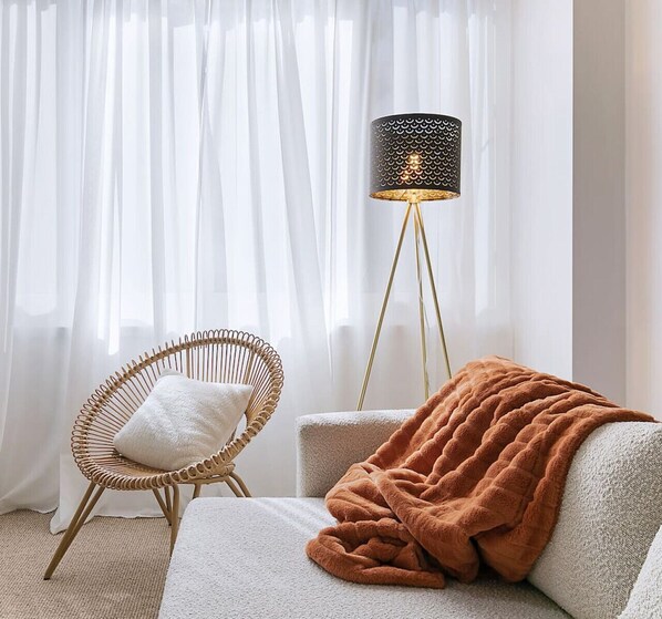 Cozy up in our living room where every corner feels like home.