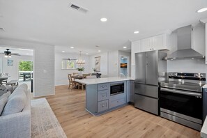 Open concept living, dining & kitchen together.