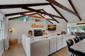 Living area with large sectional part of the open concept main level.