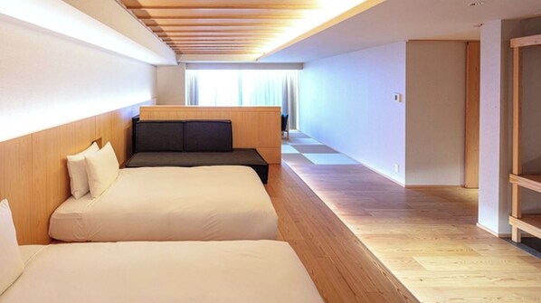 [Premium Suite] 62㎡ / bed width 1,200mm + sofa bed. A room with a warm feel.