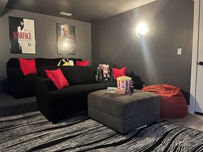 The theater room is located in the basement. DVDs and DVD player are included.