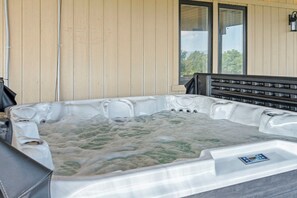 Slip into our spacious 8-person hot tub  and  unwind!