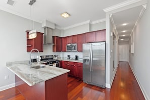 Fully equipped kitchen with modern appliances and ample counter space for all your cooking needs.